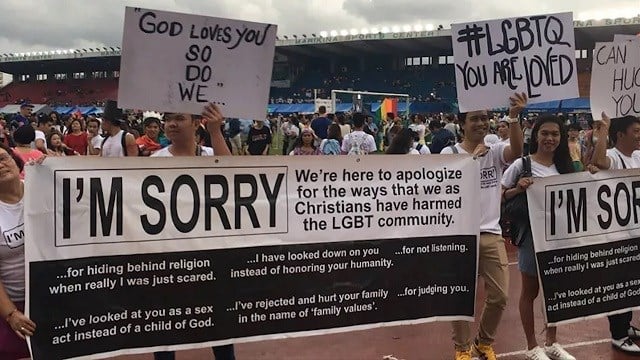   Members of the Church of Liberty in the Ministries of Christ stood at the main entrance of the parade, holding placards that apologized for the way the LGBT community was treated by the Christians. (CNN) 