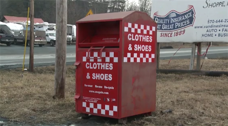 Woman dies after getting arm stuck in clothing donation bin