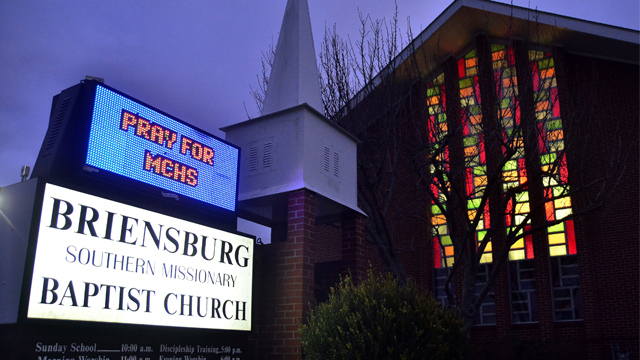 A sign at Briensburg Baptist Church asks people to pray for the victims of the shootings at Marshall County High School, Tuesday, Jan. 23, 2018, near Benton, Ky. A prayer vigil was held at the church. (AP Photo/Stephen Lance Dennee)