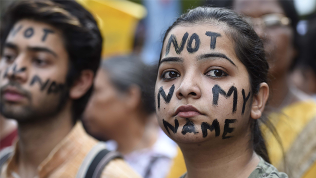 People take part in a Not In My Name protest at Parliament Street in New Dehli on April 15. (Hindustan Times via Getty Images and CNN)